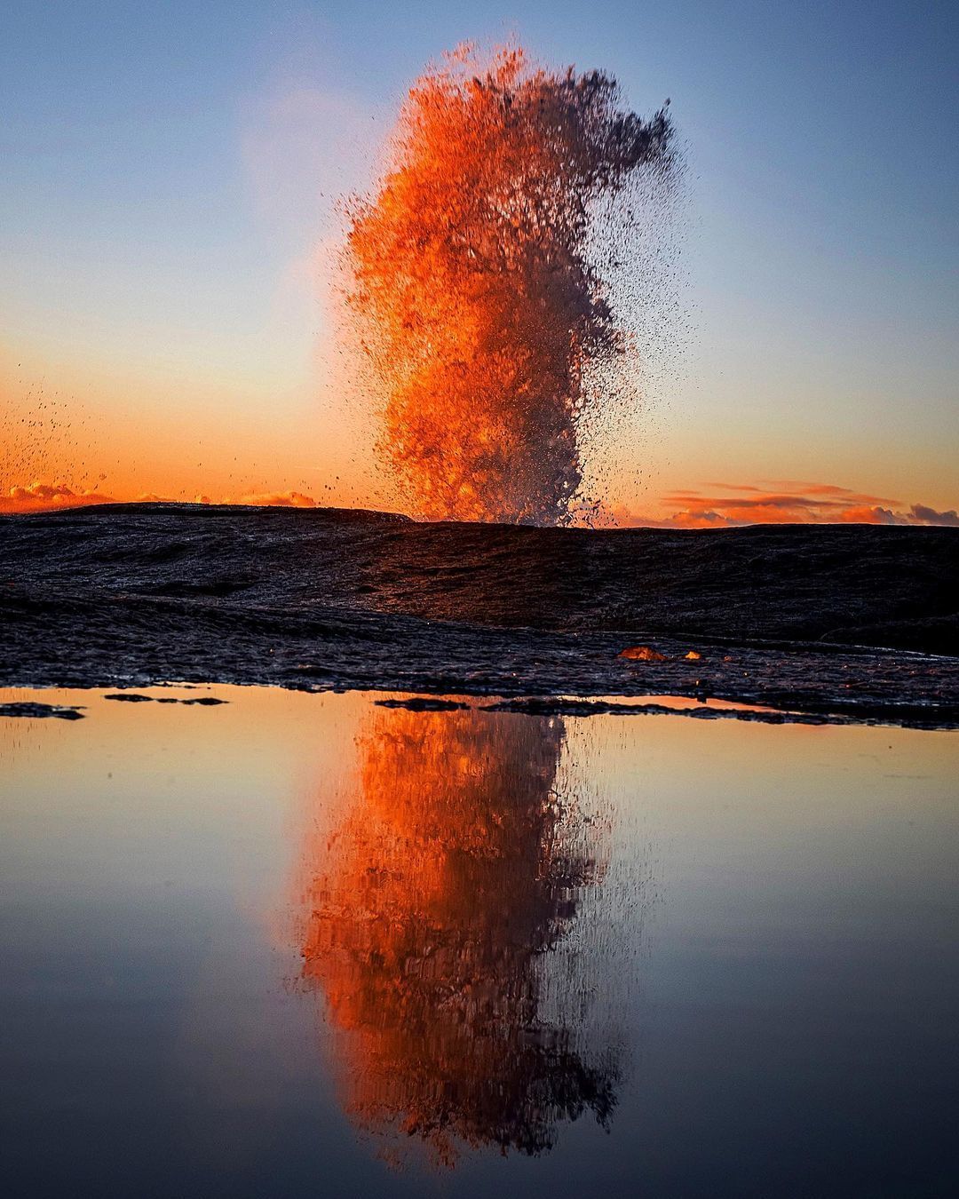 Ocean spray rising from the Bicheno Blowhole at sunrise