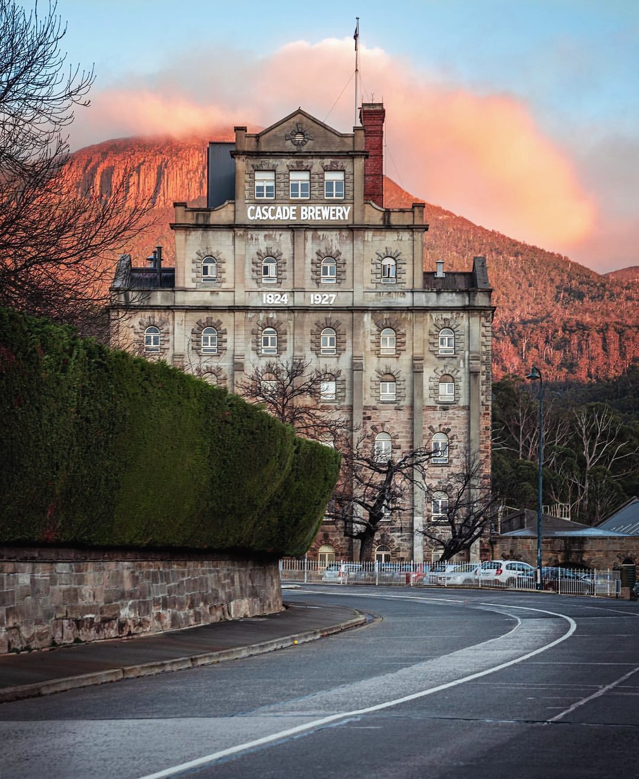 Cascade Brewery sandstone buildings beneath kunanyi Mount Wellington in Hobart