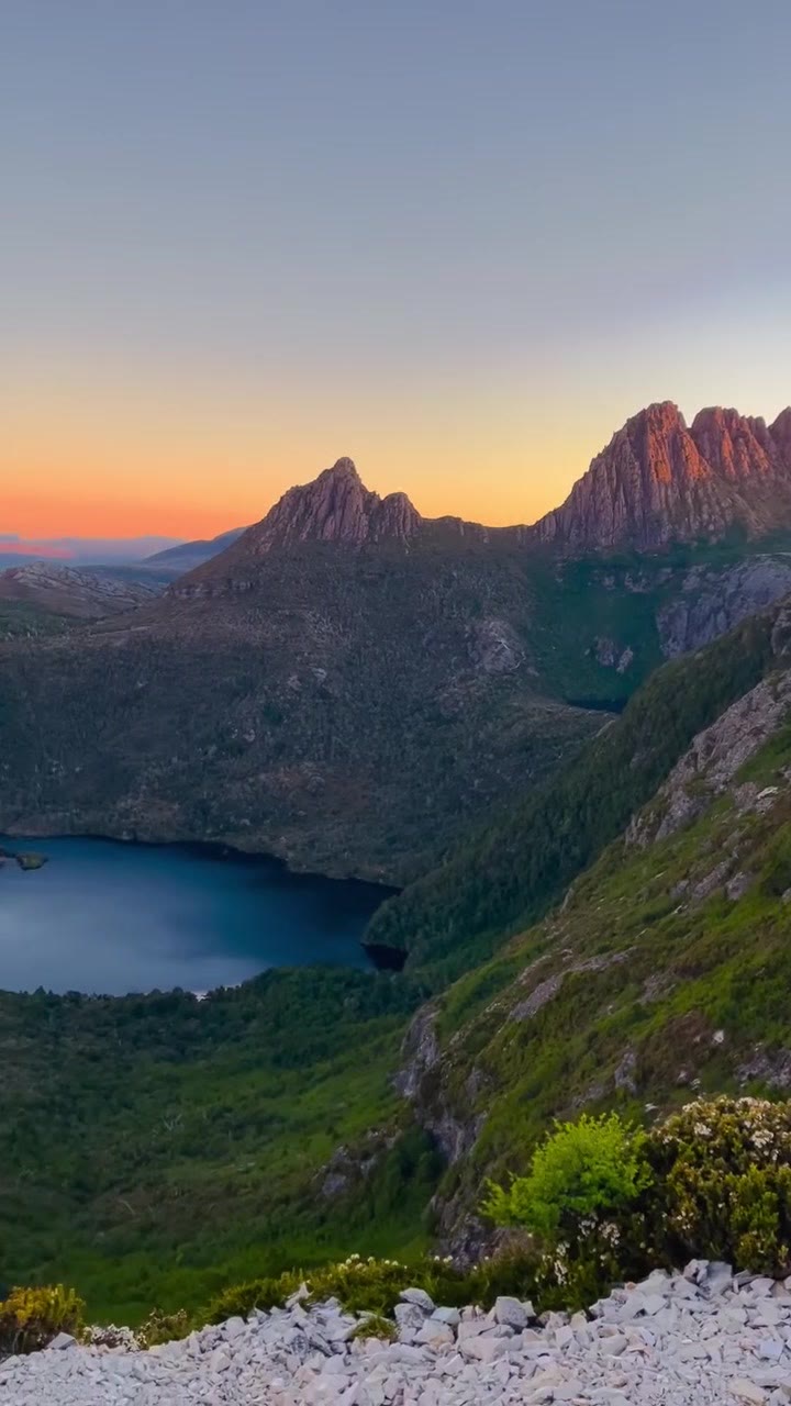 Cradle Mountain and an alpine lake at dusk