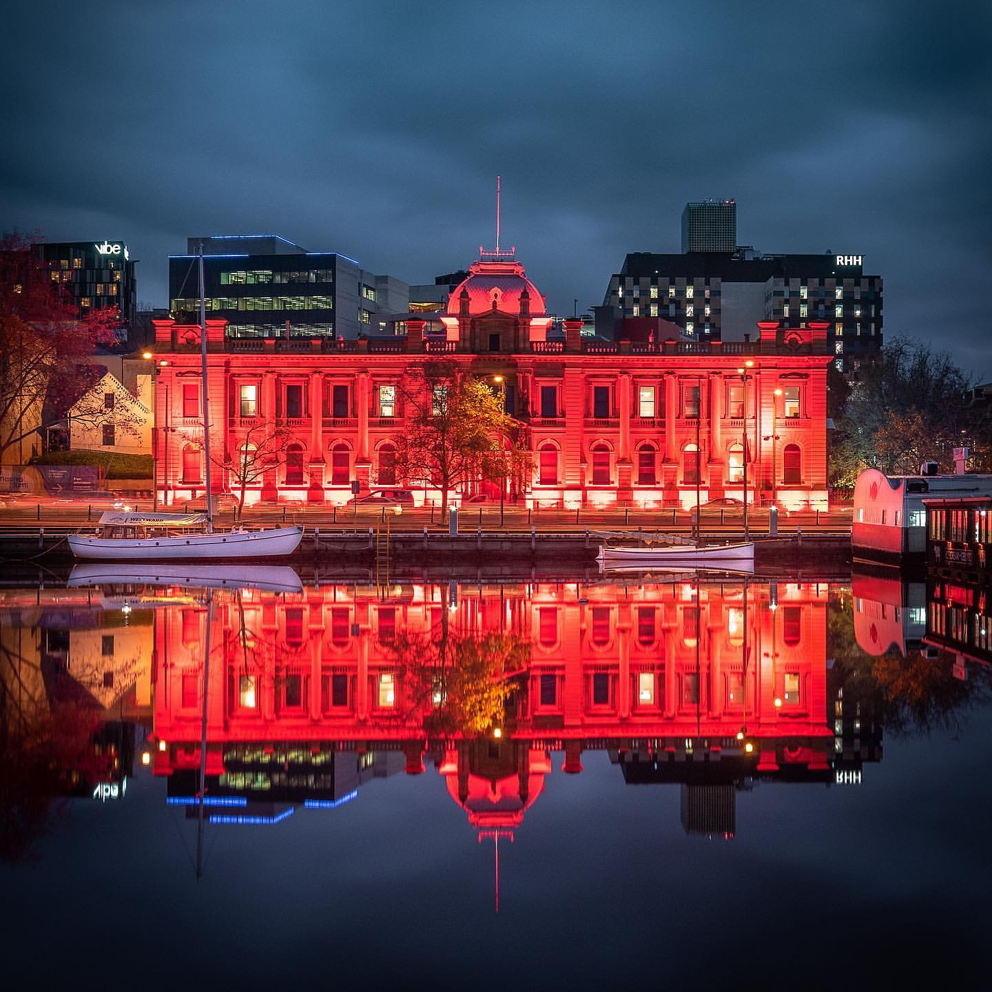Tasmanian Museum and Art Gallery illuminated red during Dark Mofo in Hobart