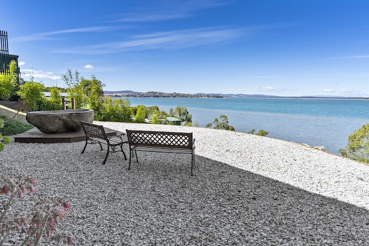 Outdoor seating overlooking the water at Penna
